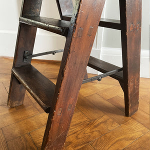 A Vintage Set of Dark Pine Folding Steps. With iron hinged stretchers and great colour and wear. They fold on a central hinge so nice and easy to store - SHOP NOW - www.intovintage.co.uk