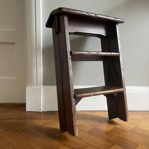 A Vintage Set of Dark Pine Folding Steps. With iron hinged stretchers and great colour and wear. They fold on a central hinge so nice and easy to store - SHOP NOW - www.intovintage.co.uk