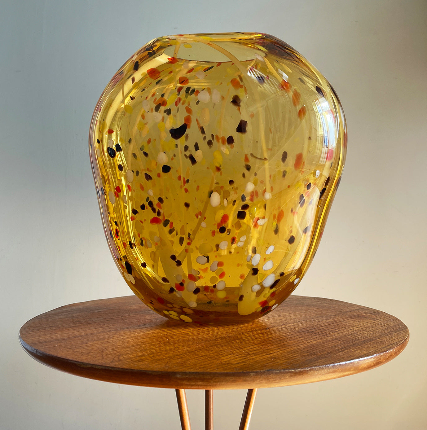 A stunning large organic hand blown glass vase. Having flecks of chocolate brown, deep orange, yellow and white within the main body of the glass giving it an almost boiled sweet look that catches the light beautifully. A nice flat bottom keeps it nice and stable.  - SHOP NOW - www.intovintage.co.uk