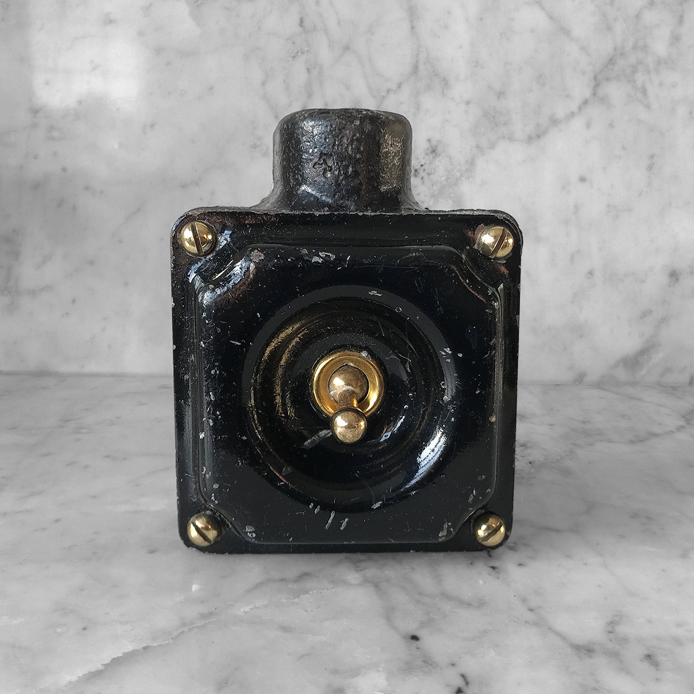 Metal Industrial Switch with a cast iron main body, pressed steel cover with brass toggle switch and brass cover screws with original finish. We have 3 of these switches in stock - SHOP NOW - www.intovintage.co.uk