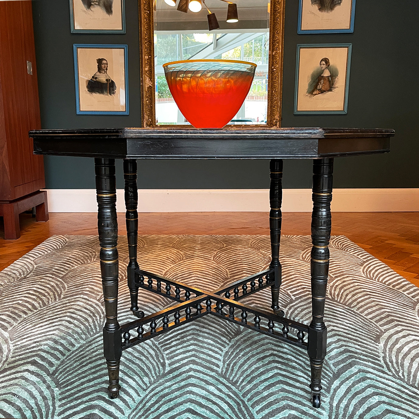 A Victorian marquetry & ebonised octagonal centre table in the Aesthetic manner by Alexander Mackenzie & Co, Glasgow.The top sees a rich burr wood veneer edged with fine blond wood marquetry, whilst underneath sees four turned ebonised legs with gold painted detailing and crossed bobbin stretchers - SHOP NOW - www.intovintage.co.uk