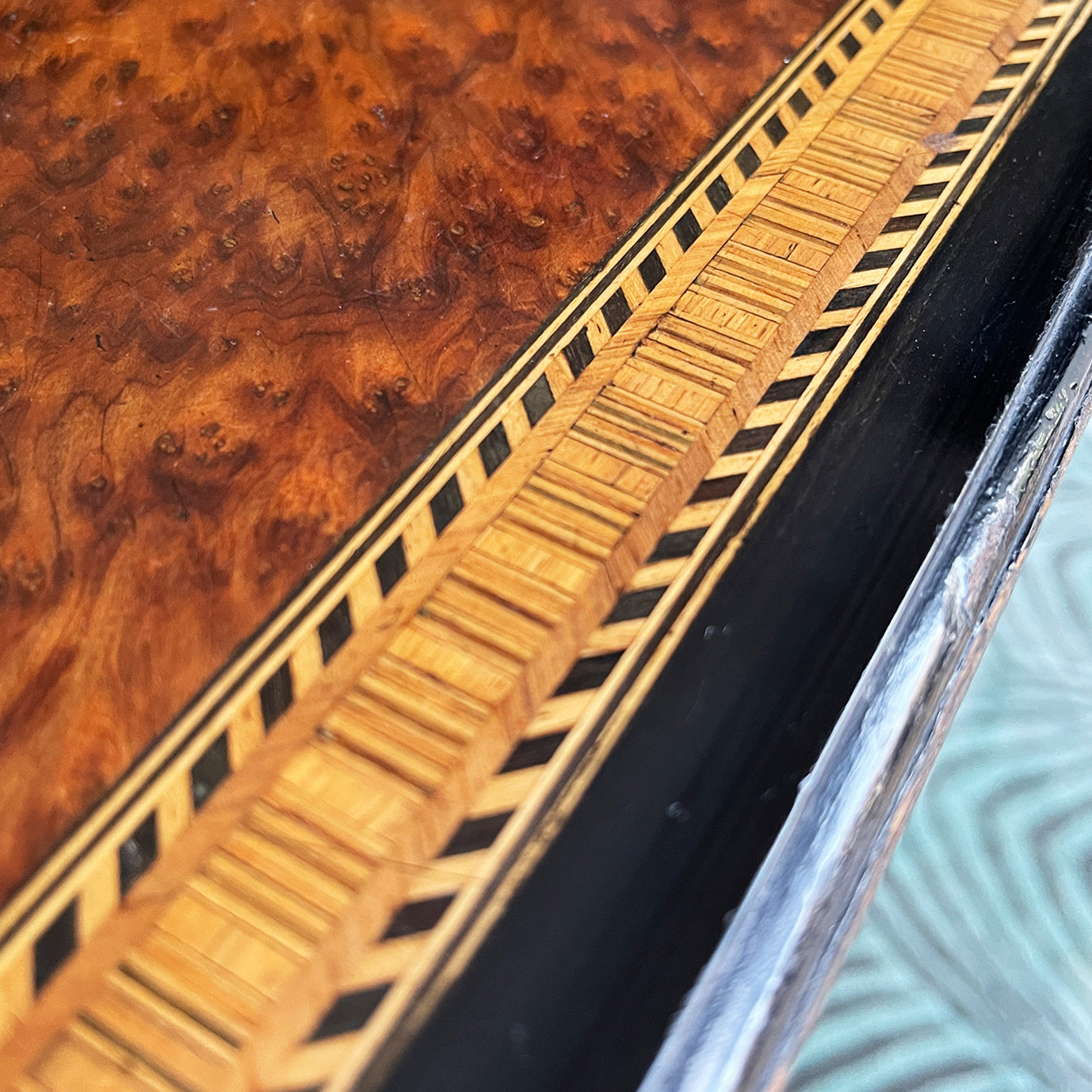 A Victorian marquetry & ebonised octagonal centre table in the Aesthetic manner by Alexander Mackenzie & Co, Glasgow.The top sees a rich burr wood veneer edged with fine blond wood marquetry, whilst underneath sees four turned ebonised legs with gold painted detailing and crossed bobbin stretchers - SHOP NOW - www.intovintage.co.uk