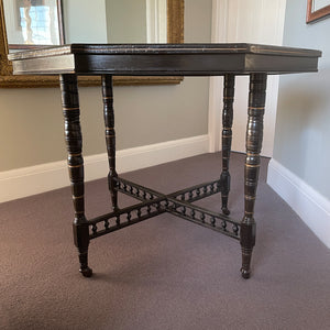 A Victorian marquetry & ebonised octagonal centre table in the Aesthetic manner by Alexander Mackenzie & Co, Glasgow.The top sees a rich burr wood veneer edged with fine blond wood marquetry, whilst underneath sees four turned ebonised legs with gold painted detailing and crossed bobbin stretchers - SHOP NOW - www.intovintage.co.uk