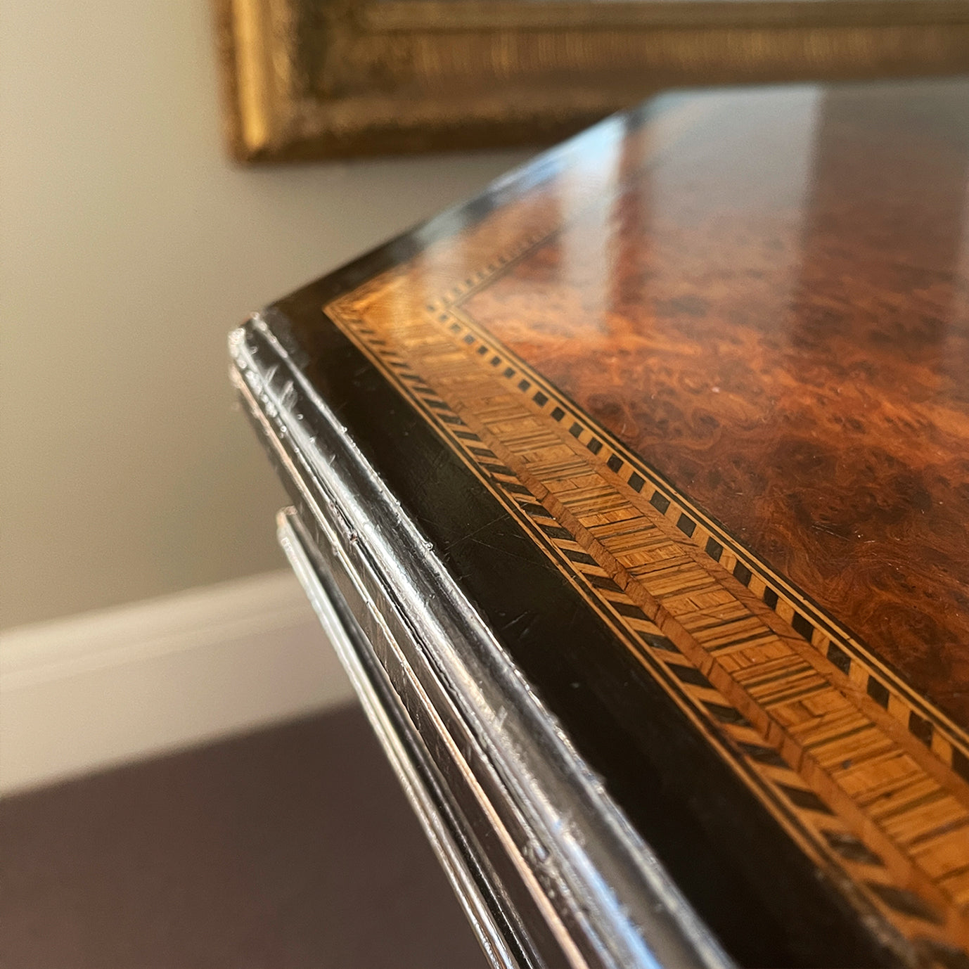 A Victorian marquetry & ebonised octagonal centre table in the Aesthetic manner by Alexander Mackenzie & Co, Glasgow.The top sees a rich burr wood veneer edged with fine blond wood marquetry, whilst underneath sees four turned ebonised legs with gold painted detailing and crossed bobbin stretchers - SHOP NOW - www.intovintage.co.uk