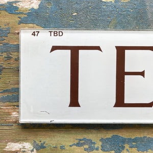 A Vintage Glass Telephone Sign from a British Red Phone Box. Transfer printed to the back of glass plate. The type is in a deep burgundy colour on to a white background - SHOP NOW - www.intovintage.co.uk 