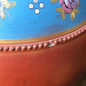 A gorgeous Victorian hand painted terracotta Vase. With bulbous form with pinkish roses with gold leaves hand painted on to a petrol blue background and finished with a raised dotted border. A beautiful decorative piece for the home - SHOP NOW - www.intovintage.co.uk