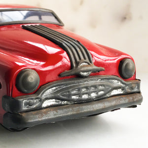 Cool 1950s tin-plate Pontiac toy car by "Minister Delux". It has a friction movement, good body work and plastic windows/screens to front and back - SHOP NOW - www.intovintage.co.uk