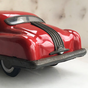 Cool 1950s tin-plate Pontiac toy car by "Minister Delux". It has a friction movement, good body work and plastic windows/screens to front and back - SHOP NOW - www.intovintage.co.uk