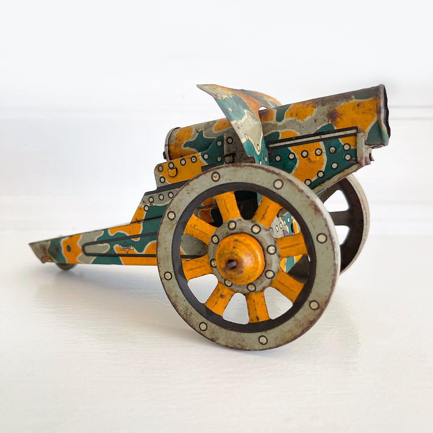 A Pre-War 1930s SHOWA tin-plate clockwork Cannon. It has a clockwork movement, that when wound moves the cannon forward, shooting bright sparks out of the gun barrel then backwards again as if the gun has recoiled! - SHOP NOW - www.intovintage.co.uk