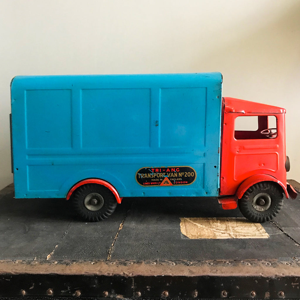 Cool Vintage Tri-ang Van No 200. The cab and wheel arches are finished in a popping red colour with the back storage section finished in a retro period light blue. It has two original Tri-ang decals on the sides and a pressed tin front radiator and lights - SHOP NOW - www.intovintage.co.uk