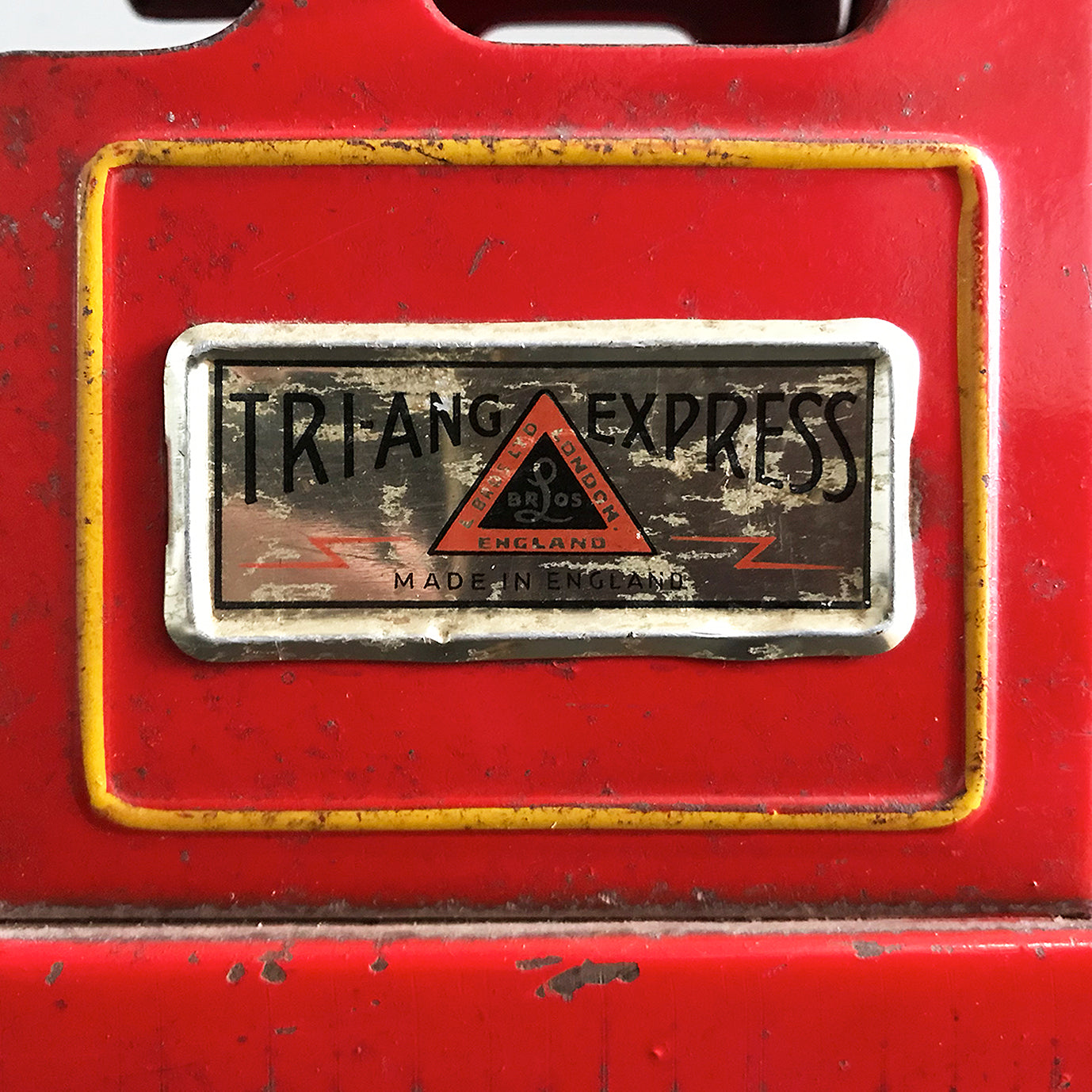 Vintage Tri-ang Express Toy Train. Finished in a glorious red colour with yellow painted details. It has two original Tri-ang Express decals on its sides - SHOP NOW - www.intovintage.co.uk