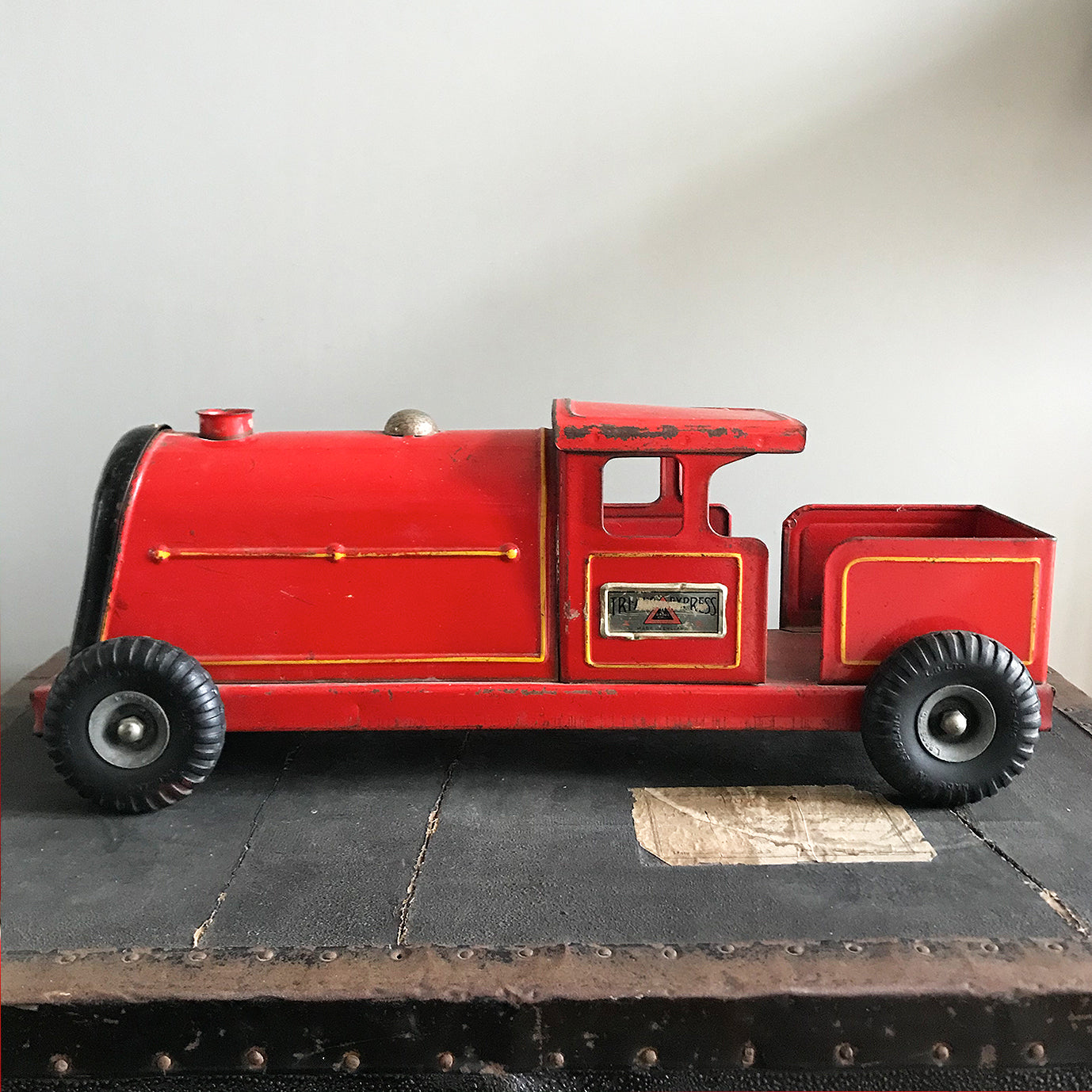 Vintage Tri-ang Express Toy Train. Finished in a glorious red colour with yellow painted details. It has two original Tri-ang Express decals on its sides - SHOP NOW - www.intovintage.co.uk