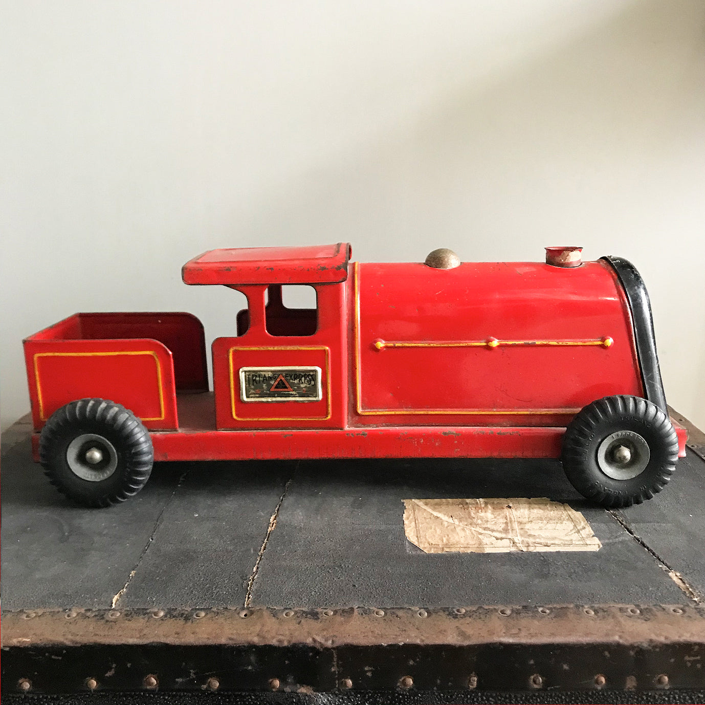 Vintage Tri-ang Express Toy Train. Finished in a glorious red colour with yellow painted details. It has two original Tri-ang Express decals on its sides - SHOP NOW - www.intovintage.co.uk
