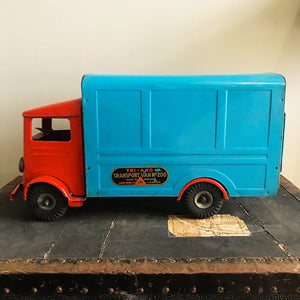 Cool Vintage Tri-ang Van No 200. The cab and wheel arches are finished in a popping red colour with the back storage section finished in a retro period light blue. It has two original Tri-ang decals on the sides and a pressed tin front radiator and lights - SHOP NOW - www.intovintage.co.uk