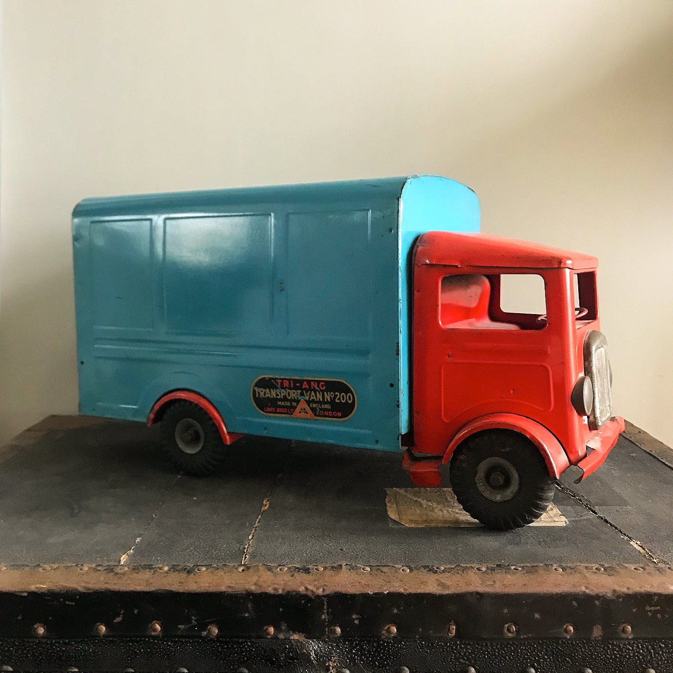 Cool Vintage Tri-ang Van No 200. The cab and wheel arches are finished in a popping red colour with the back storage section finished in a retro period light blue. It has two original Tri-ang decals on the sides and a pressed tin front radiator and lights - SHOP NOW - www.intovintage.co.uk