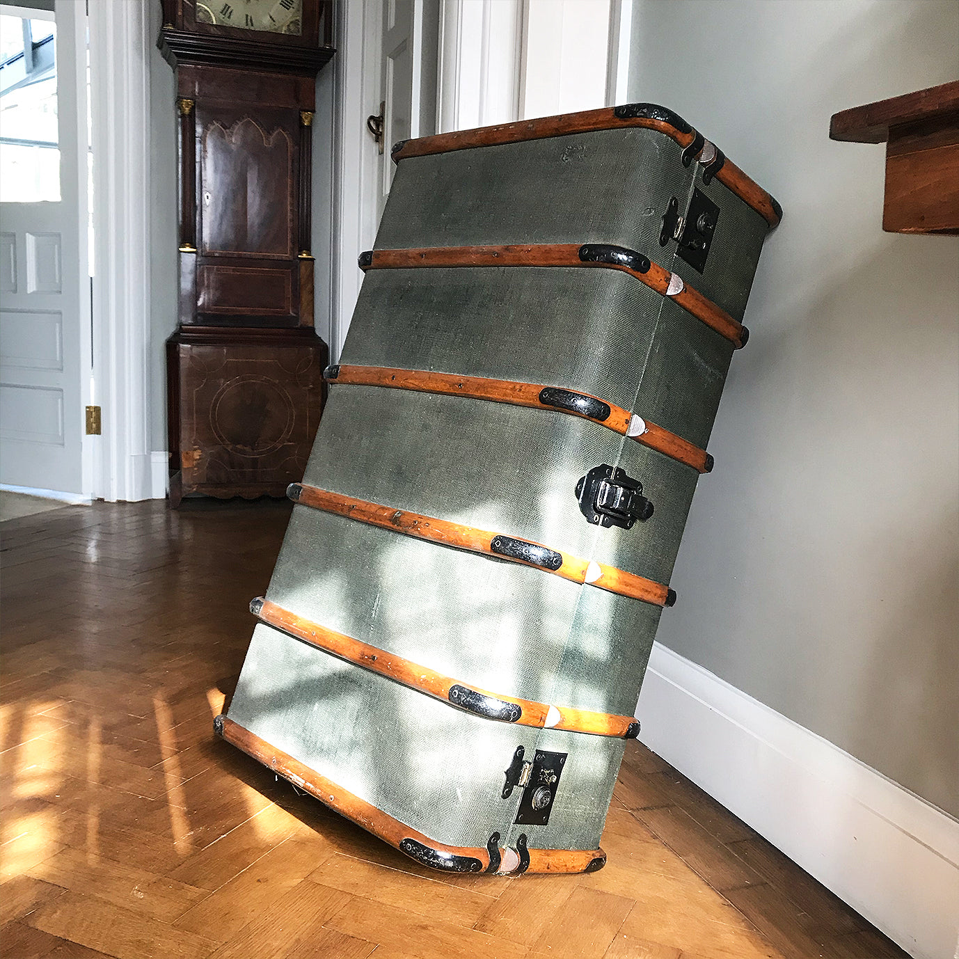 Good looking Edwardian Steamer Trunk in fantastic condition. Finished in a green applied hessian with beautifully rich bent wood straps. It has two lockable latches with a key, and a central main latch all finished in black. There are two thick leather carry handles on each end - SHOP NOW - www.intovintage.co.uk