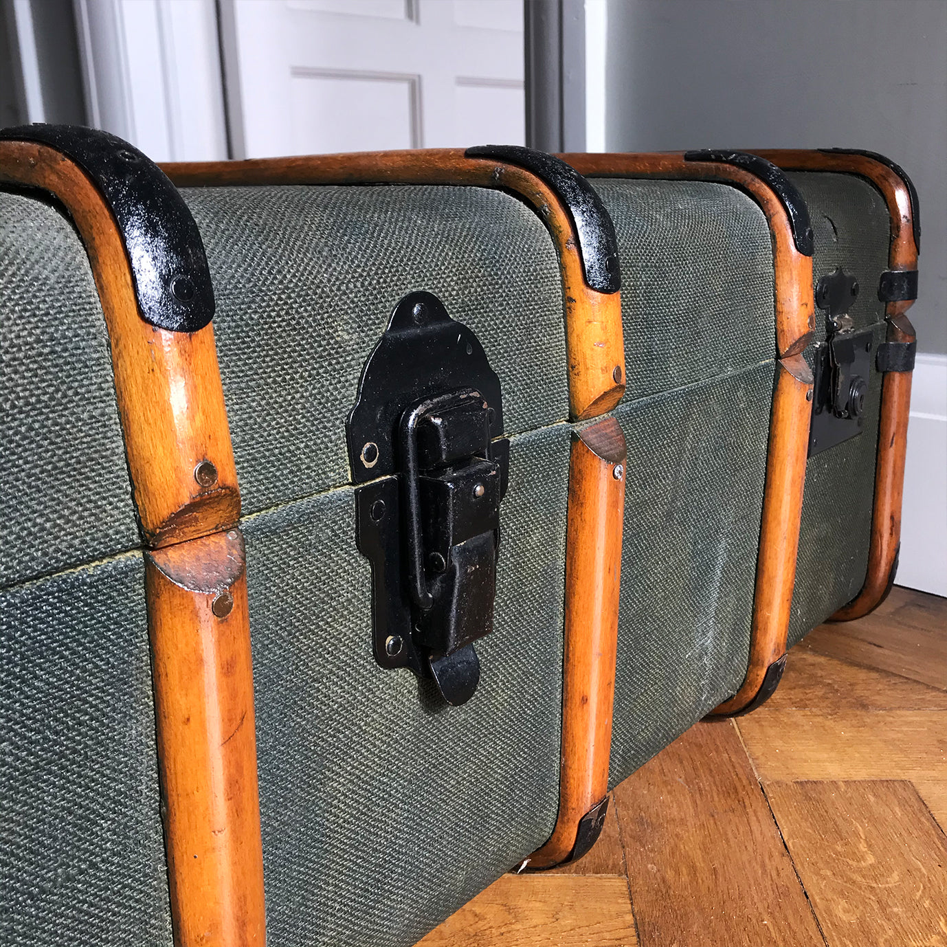 Good looking Edwardian Steamer Trunk in fantastic condition. Finished in a green applied hessian with beautifully rich bent wood straps. It has two lockable latches with a key, and a central main latch all finished in black. There are two thick leather carry handles on each end - SHOP NOW - www.intovintage.co.uk