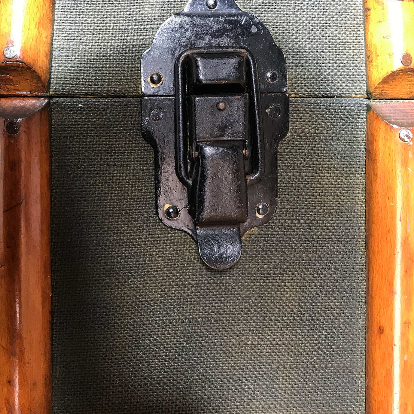 Good looking Edwardian Steamer Trunk in fantastic condition. Finished in a green applied hessian with beautifully rich bent wood straps. It has two lockable latches with a key, and a central main latch all finished in black. There are two thick leather carry handles on each end - SHOP NOW - www.intovintage.co.uk