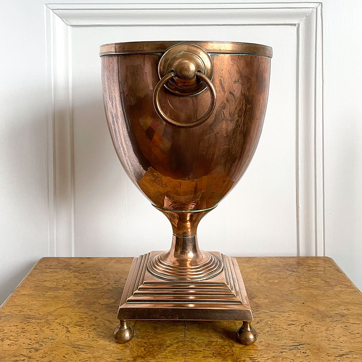 A Large Antique Classical Copper Urn ideal for use as a wine cooler. It has two ring handles and a beautiful stepped base stood on rounded feet -SHOP NOW - www.intovintage.co.uk