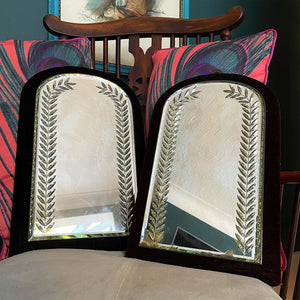 A fine pair of Victorian Velvet Framed Bright Cut Mirrors. Each mirror has deep red, almost black velvet frame with an arched mirror plate. The plates have bright cut leaf motifs that frame and catch the light beautifully - SHOP NOW - www.intovintage.co.uk