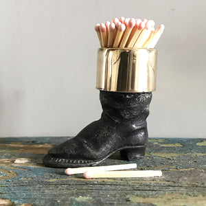Well modelled Victorian vesta case of an old boot. Cast from metal with a brass cuff it has a striker on its sole to light your match - SHOP NOW - www.intovintage.co.uk