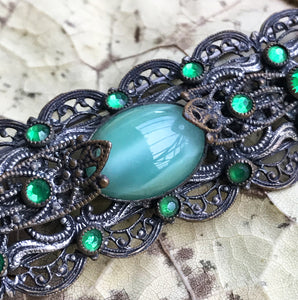 Excellent quality Victorian Brooch with intricate design detail with numerous faceted glass emeralds surrounding three larger green glass cabochon gems - SHOP NOW -  www.intovintage.co.uk