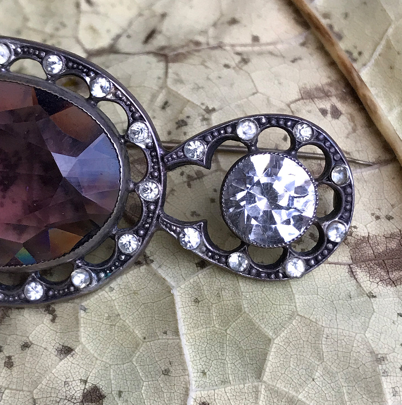 Beautiful quality Victorian brooch with a pale purple cut glass centre gem that is surrounded by a fabulous cut glass diamond studded border with two larger cut glass diamonds at each end - SHOP NOW - www.intovintage.co.uk