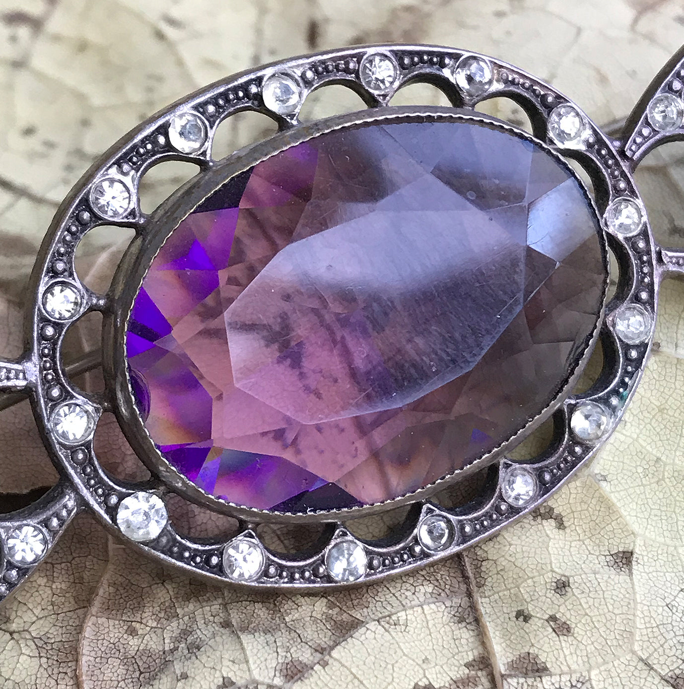 Beautiful quality Victorian brooch with a pale purple cut glass centre gem that is surrounded by a fabulous cut glass diamond studded border with two larger cut glass diamonds at each end - SHOP NOW - www.intovintage.co.uk