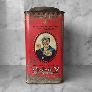 Antique Victory-V lozenge tin with glass window panel to the front, dating to around 1920. The tin has two lithographed panels to the sides, one being a fantastic image of the companies trademark sailor 'Jolly Jack', the other being an image of Horatio Nelson's Battle of Trafalgar flagship H.M.S. Victory.- SHOP NOW - www.intovintage.co.uk