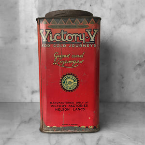 Antique Victory-V lozenge tin with glass window panel to the front, dating to around 1920. The tin has two lithographed panels to the sides, one being a fantastic image of the companies trademark sailor 'Jolly Jack', the other being an image of Horatio Nelson's Battle of Trafalgar flagship H.M.S. Victory.- SHOP NOW - www.intovintage.co.uk