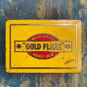 A Vintage Gold Flake Honey Dew Tobacco Tin from W.D & H.O Wills. Great colourful graphics to the front and sides with further typography to the inside lid. - SHOP NOW - www.intovintage.co.uk