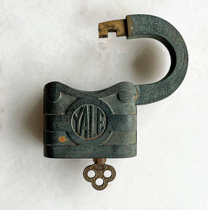 A large vintage Yale Brass Padlock with a wonderful verdigris finish to the brass. Very solid with a satisfying clunk when locked. Fully working with original key - SHOP NOW - www.intovintage.co.uk