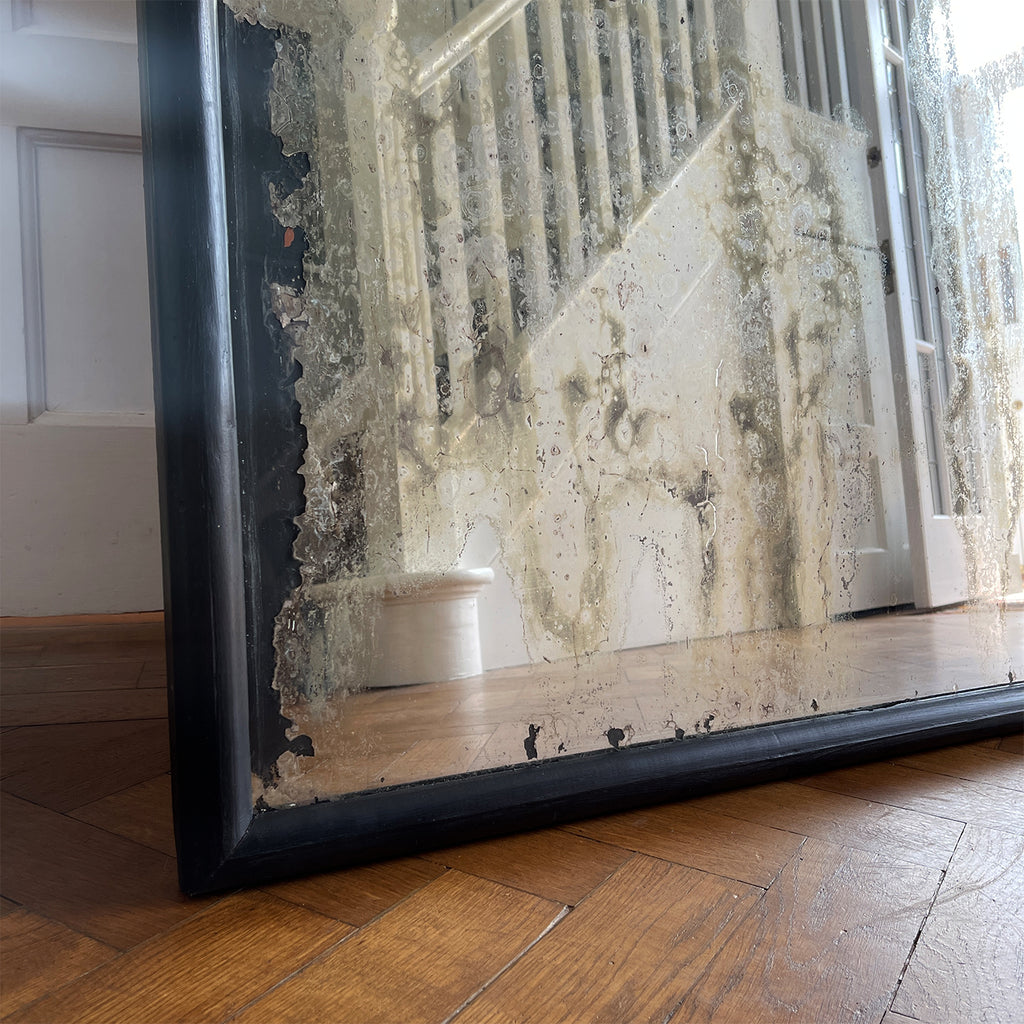 An impressive large and heavily foxed vintage mirror with a waxed black ebonised wooden frame - SHOP NOW - www.intovintage.co.uk